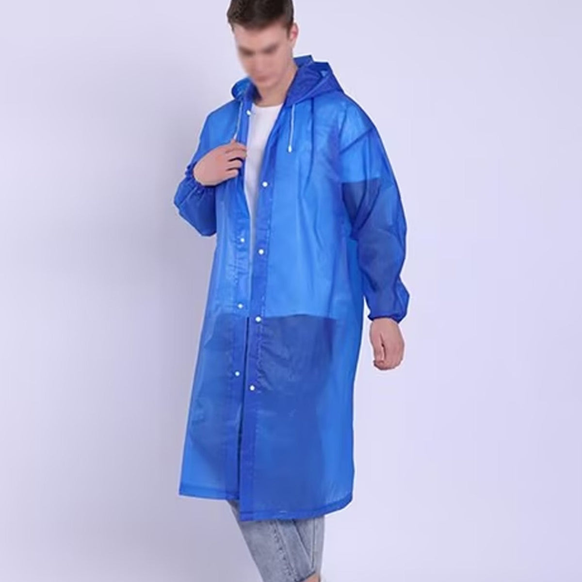 A man wearing a translucent blue EVA raincoat with a hood, standing with his hands near the collar.