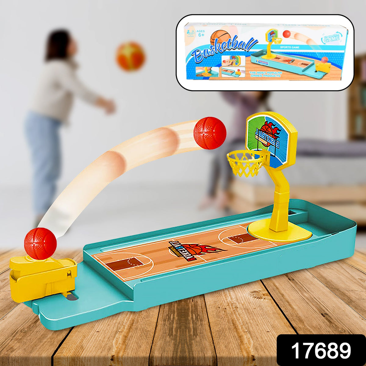 A miniature basketball game on a wooden surface, with a product box overlay showing the game in action.