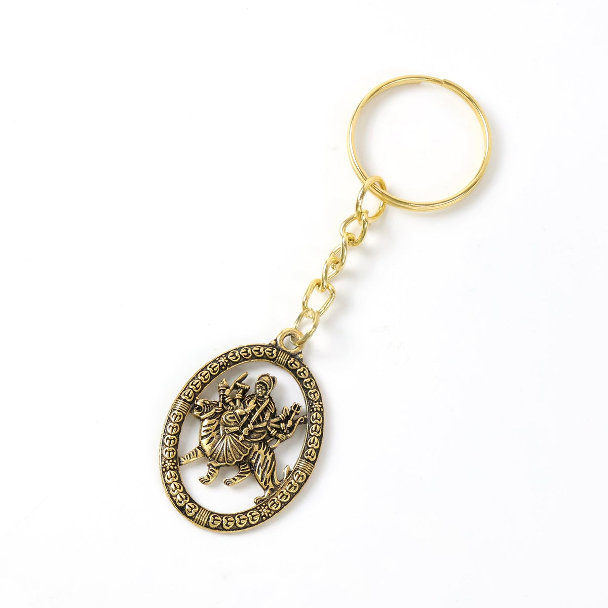 A golden keychain with an oval pendant featuring a detailed deity, isolated on a clean white background.