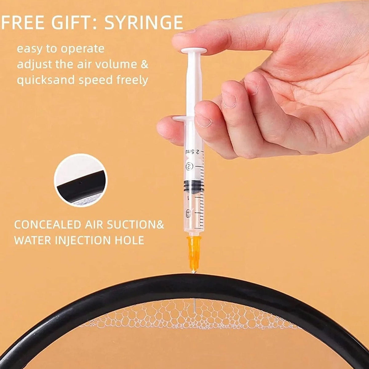 A hand holding a syringe, pointing towards the top edge of the black frame of the sand art, with text about adjusting air.