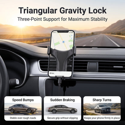 A phone in a black gravity lock car holder on a dashboard, with text