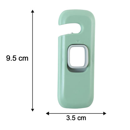 A green and grey child safety lock with dimensions of 9.5 cm length and 3.5 cm width indicated by arrows.