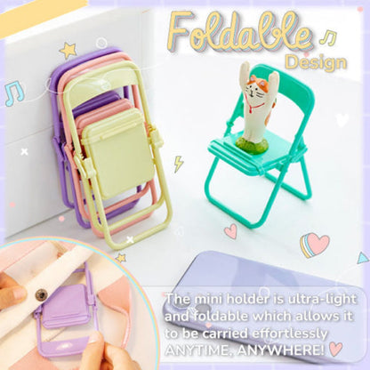 A stack of folded pastel chairs next to a teal chair holding a cat figurine, with a phone and text overlay.