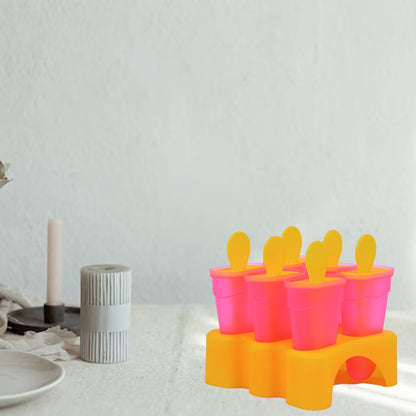 Popsicle moulds with their lids on, ready to be placed in the freezer.