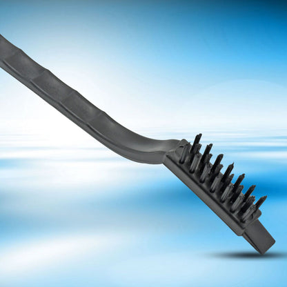 A close-up of a black-handled mini wire brush with black nylon bristles against a blue gradient background.