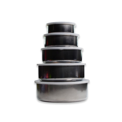A stack of five stainless steel food containers with clear lids, decreasing in size from bottom to top, isolated on a white