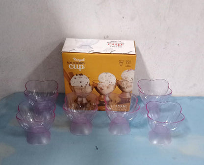 Eight clear and purple plastic ice cream bowls arranged in front of a 'Royal Ice Cream Cup' box.