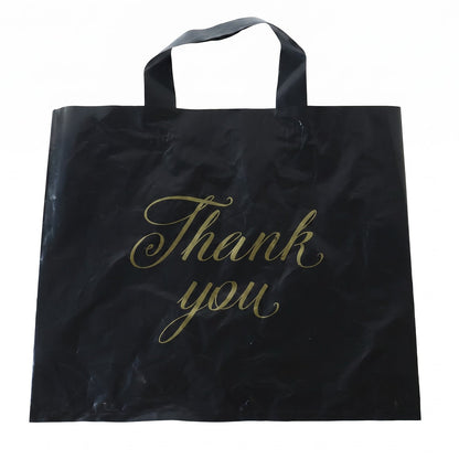 A black plastic 'Thank You' bag with gold script is displayed flat against a plain white background.