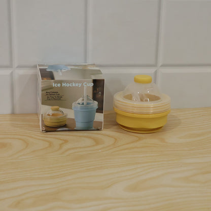 Live photo of a silicone foldable travel cup with straw and dome lid