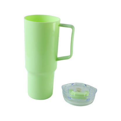 A light green plastic travel tumbler with a handle is shown next to its clear lid on a white background.
