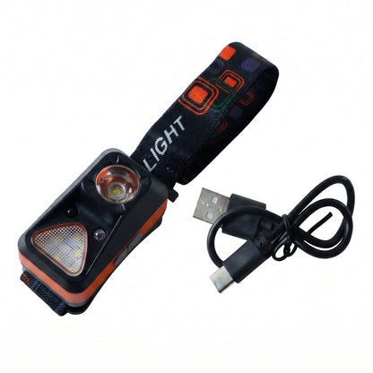The orange and black headlamp with its patterned strap and a coiled USB-C charging cable on a white background.