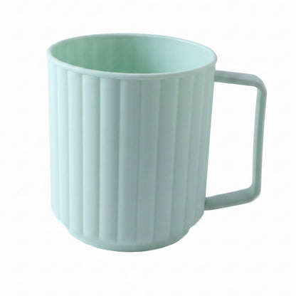 Plastic drinking mug on white background